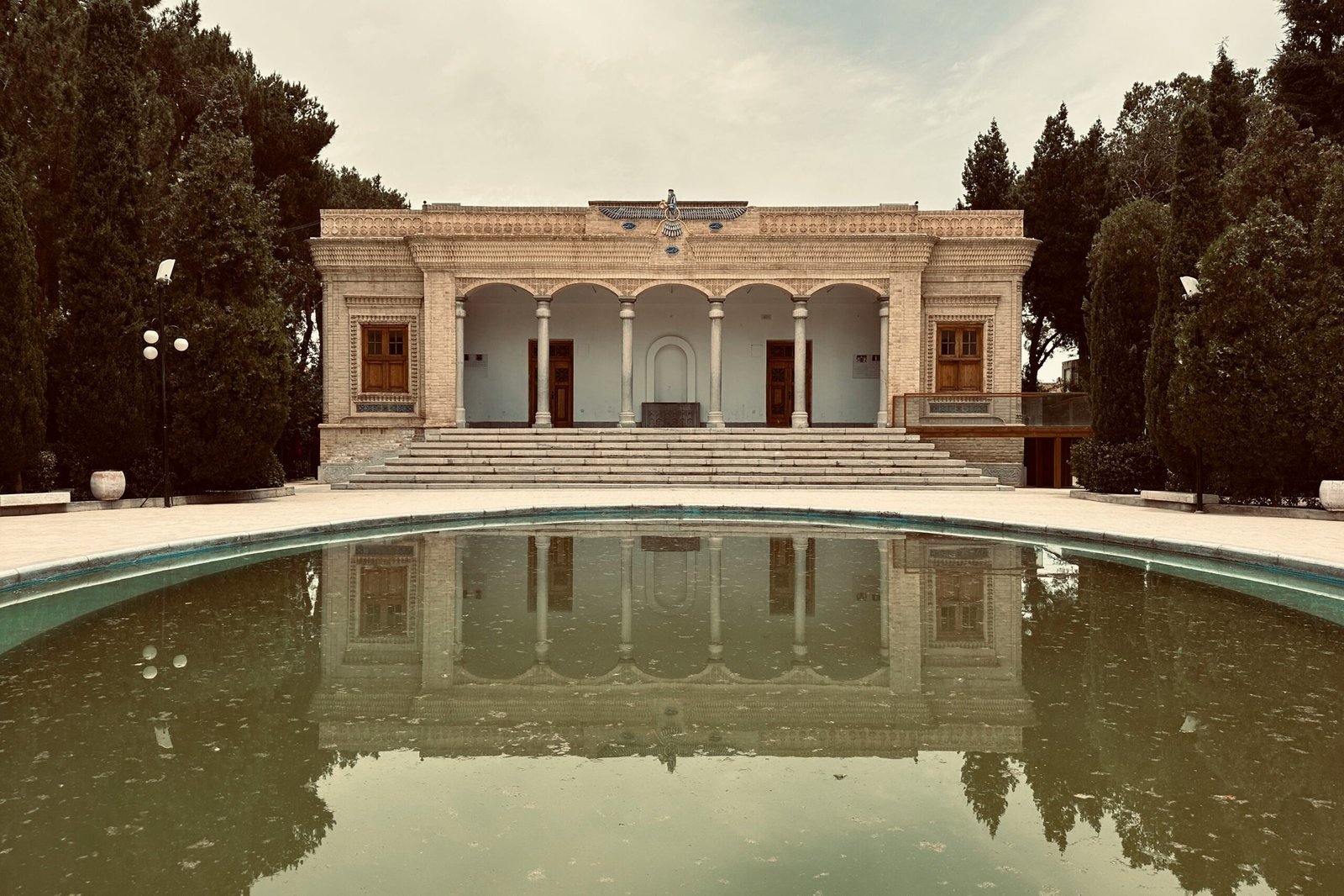 a building with a pool in front of it